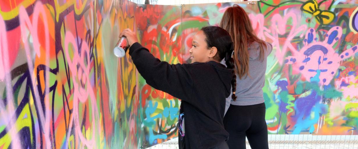 Girl spray painting creatively